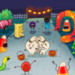 A group of teeth huddle together as candy monsters terrorize them at Halloween
