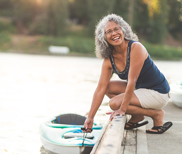 senior woman with a kayak